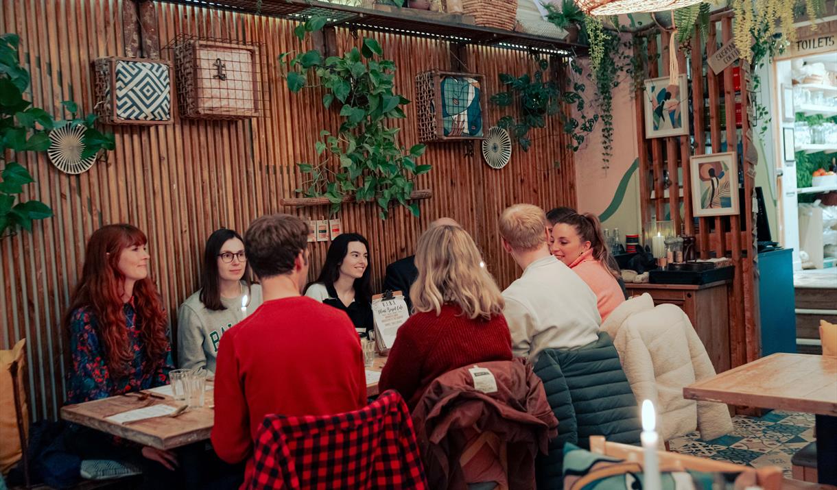 Friends Enjoying Dinner at Vibes