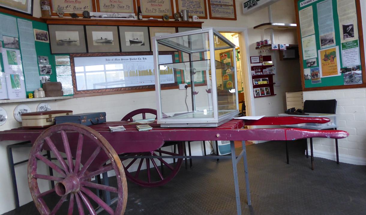 Inside the Museum and an original cart to carry the luggage of visitors to their hotels around Douglas Bay