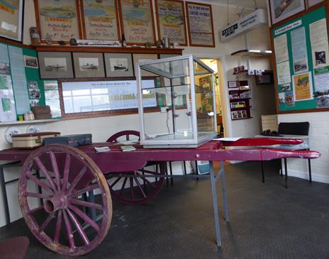 Inside the Museum and an original cart to carry the luggage of visitors to their hotels around Douglas Bay