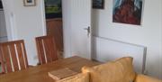 Chapel Bay Lodge lounge and dining area leading through to hallway to bathroom and bedroom
