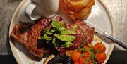 Plated picture of a cooked sirloin steak