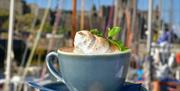 Boatyard Coffee Budino dish presented in front of the marina