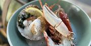 Picture of local seafood on a plate.