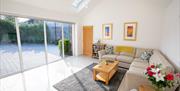 Sunny modern lounge, underfloor heating and vaulted ceiling