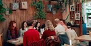 Friends Enjoying Dinner at Vibes