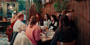 Friends Enjoying Dinner at Vibe
