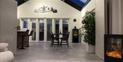 Tri-folding doors lead in to the large kitchen diner