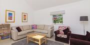 Sunny modern lounge, underfloor heating and vaulted ceiling