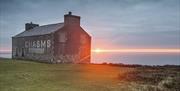 The sun rises under a heavy sky at the old cliff top Chasms Cafe, on the Isle of Man.
Photography Workshops with Mark Boyd Photography.