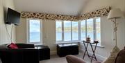 Upstairs sun / sunset lounge at Bay View Cottage with the best sea views!