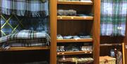 Shelving showing Manx tartan