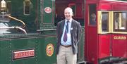 Blue-badge guide Chris Callow with vintage IMR locomotive No 13 Kissack