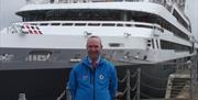 Blue-badge guide Chris Callow meeting clients on a cruise-ship assignment
