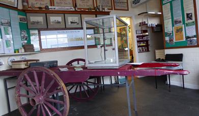 Inside the Museum and an original cart to carry the luggage of visitors to their hotels around Douglas Bay