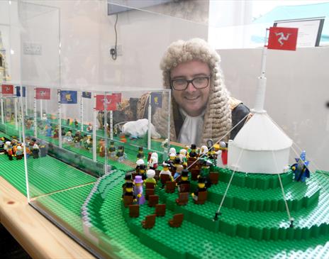 Speaker of the House of Keys inspecting the custom-built Lego model of Tynwald Day